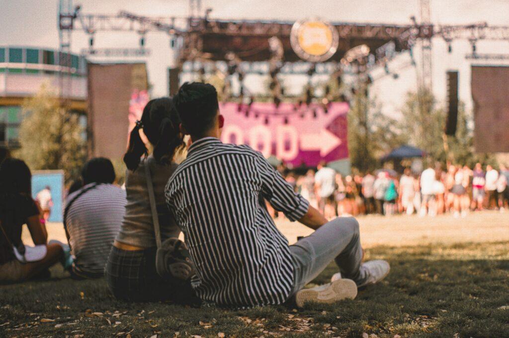 Couple Listening To Music In Park