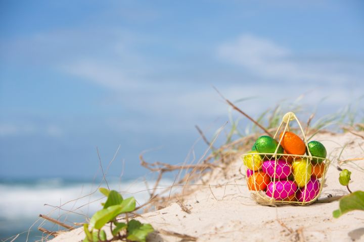 Easter Basket with Eggs on Beach